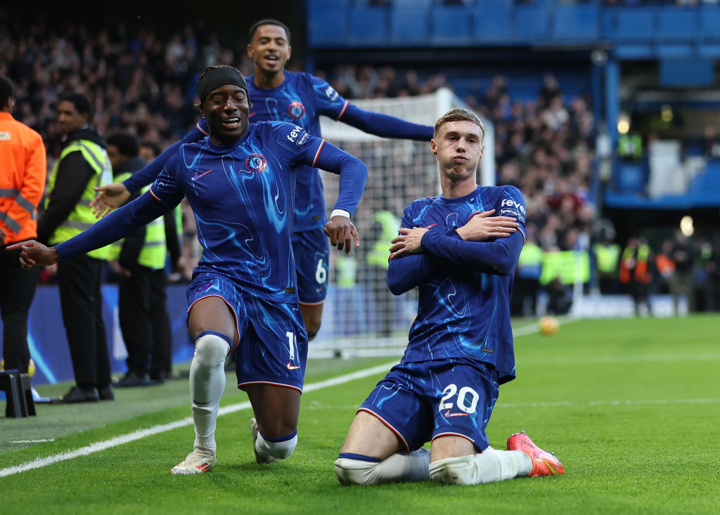 Cole Palmer of Chelsea celebrates scoring his team's third goal with Noni Madueke during the Premier League match between Chelsea FC and Aston Villa FC at Stamford Bridge on December 01, 2024 in London, England