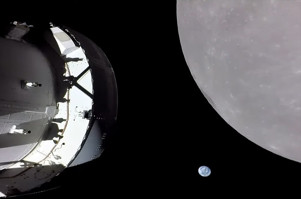 Earth and the Moon as seen by NASA's Artemis I Orion spacecraft as it approaches the Moon on Monday, November 21, 2022.