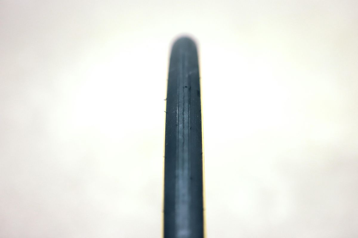 A tan bicycle tyre on a white background