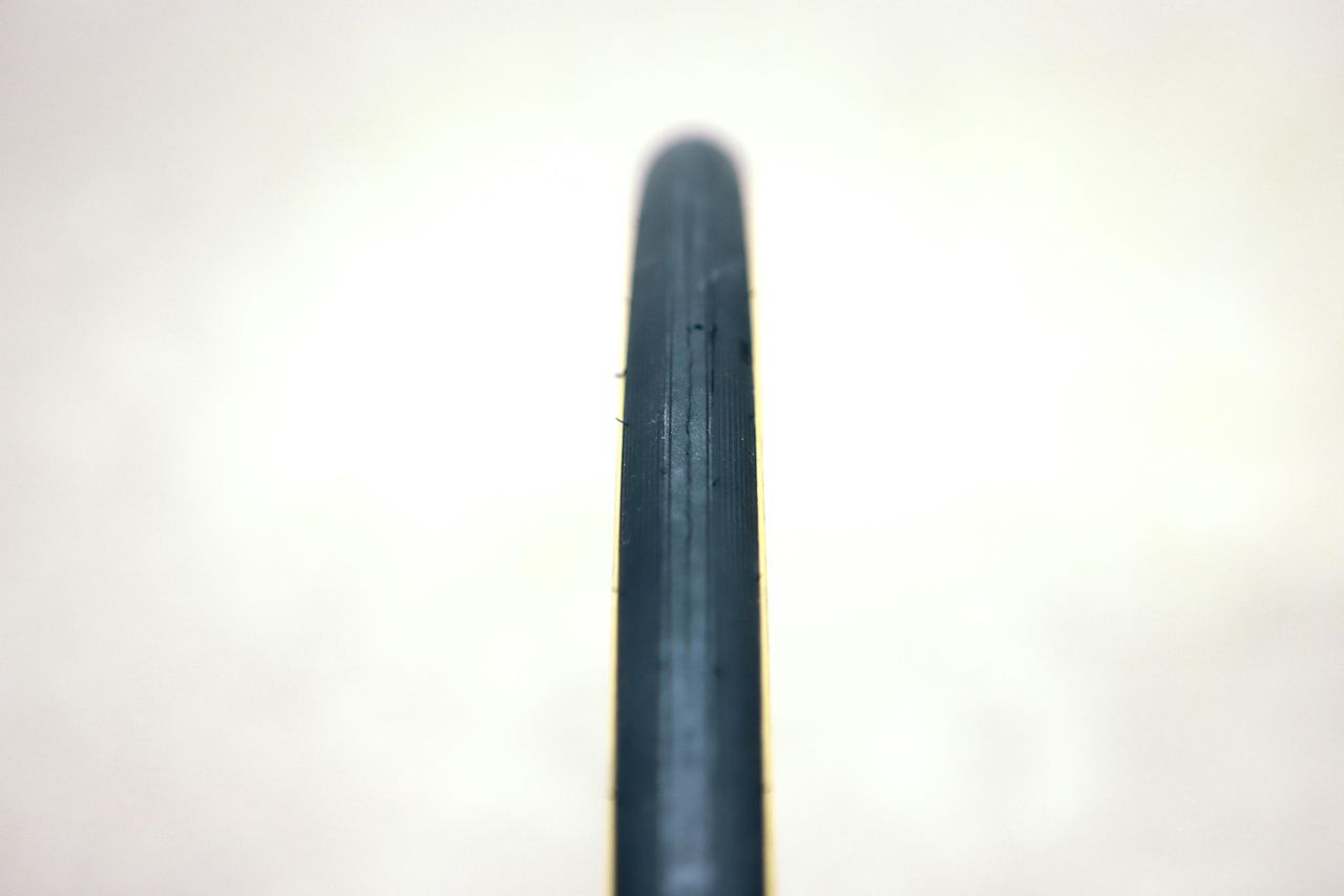 A tan bicycle tyre on a white background