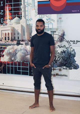 Artist Tavares Strachan in front of his piece, The Awakening,