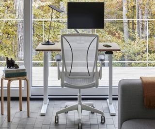 An ergonomic office chair in a light home office