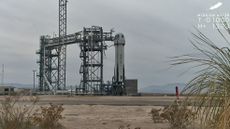 Blue Origin's New Shepard suborbital vehicle stands on the launch pad at the company's West Texas site on Jan. 28, 2025. A liftoff planned for that day was scrubbed due to weather and an avionics issue.