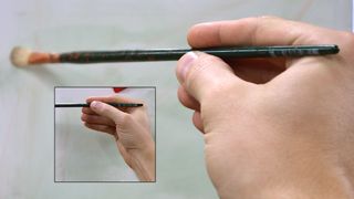 oil painting techniques: person holding paintbrush