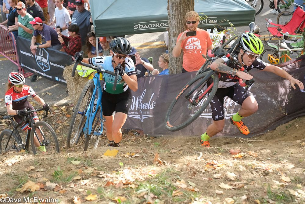 Jenna Greaser carrying her bike while others chose to push theirs.