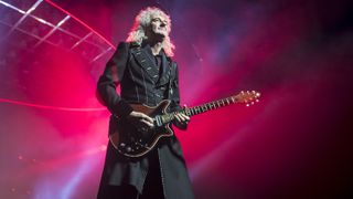 Brian May of Queen performs live on stage at The O2 Arena on December 12, 2017 in London, England