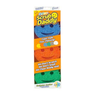 A pack of three blue, orange, and green Scrub Daddys in an orange and yellow box