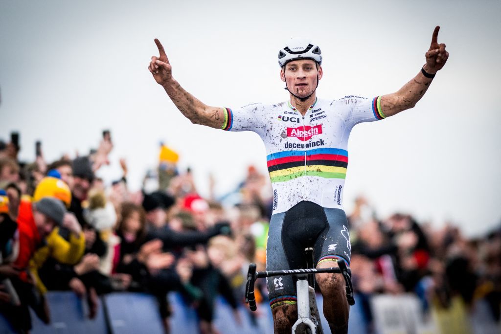 Dutch Mathieu Van Der Poel celebrates as he crosses the finish line to win men's elite race of the 'Duinencross' cyclocross cycling event, stage five of the X2O Badkamers Trophy (Trofee Veldrijden) competition, in Koksijde, western Belgium, on January 4, 2024. (Photo by JASPER JACOBS / Belga / AFP) / Belgium OUT