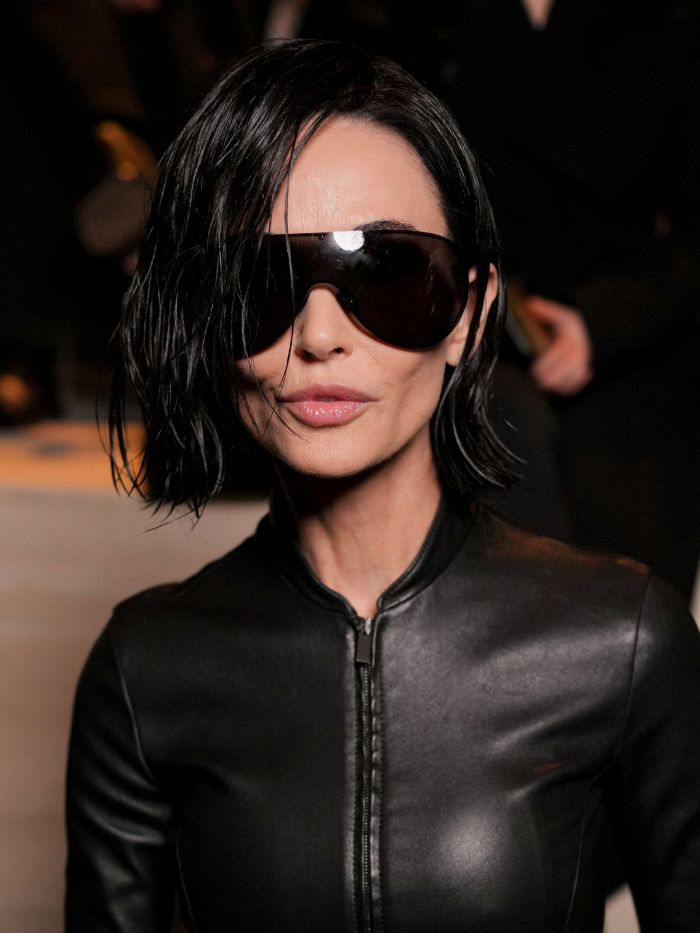 Demi Moore at the Gucci fashion show as part of Milan Fashion Week Fall 2026 held at the Piazza VI Febbraio on February 27, 2026 in Milan, Italy with a wet-look bob hairstyle