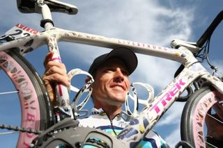 Lance Armstrong poses with his Damien Hirst-painted Trek at the conclusion of the 2009 Tour de France
