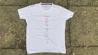 adidas Terrex Agravic Trail Running t-shirt, unworn, flat on paving stones, showing front detail