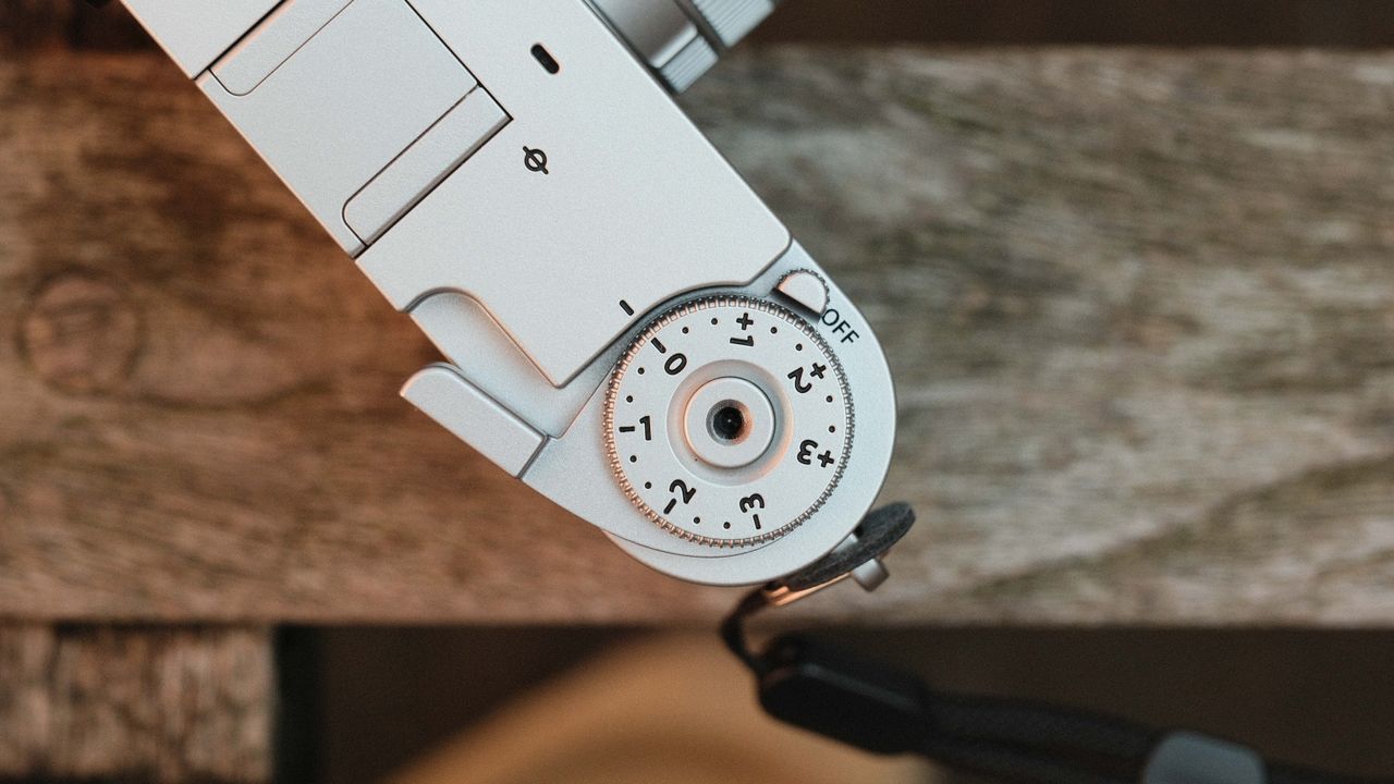 Fujifilm X Half camera on a wooden bench