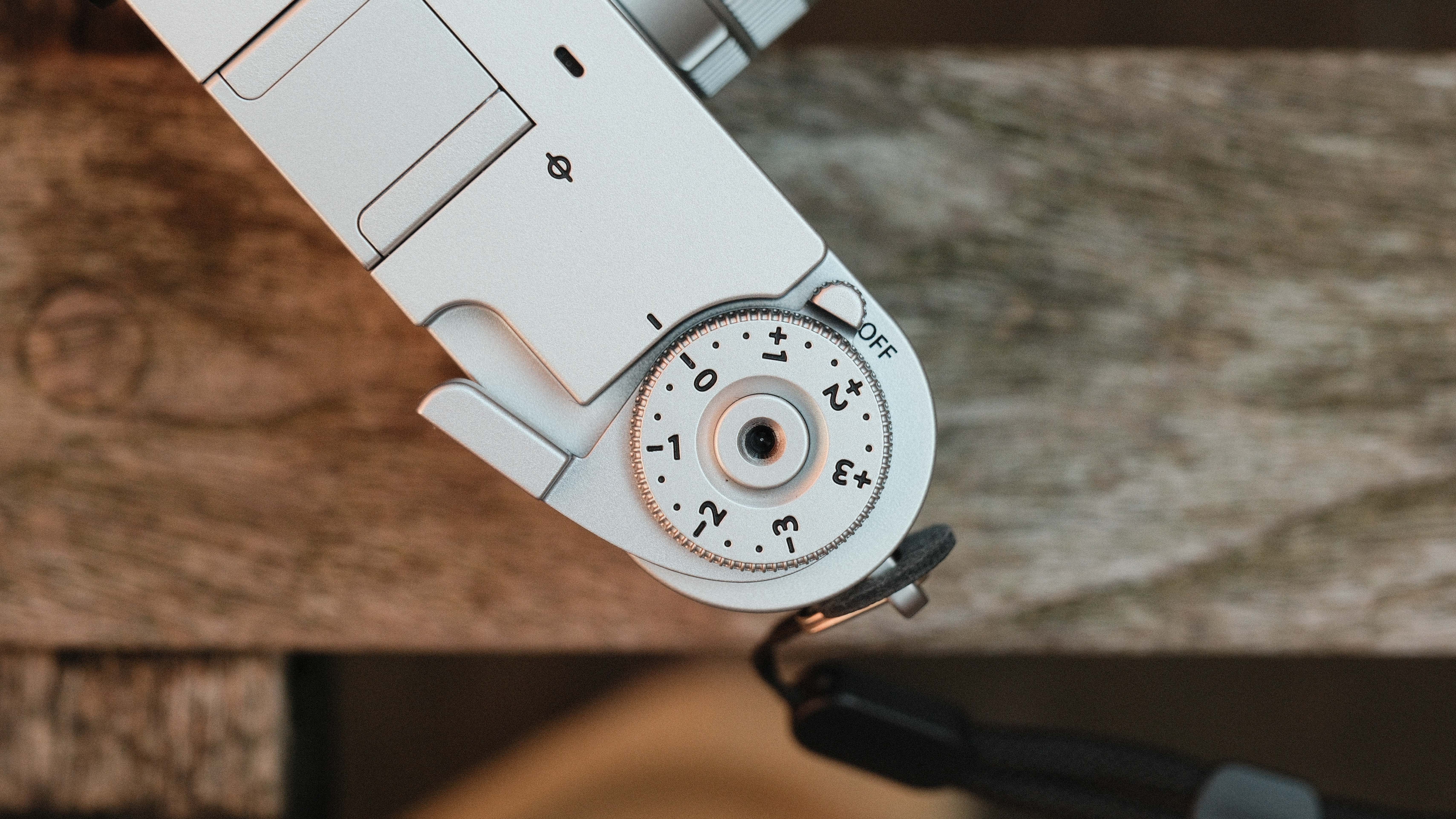 Fujifilm X Half camera on a wooden bench