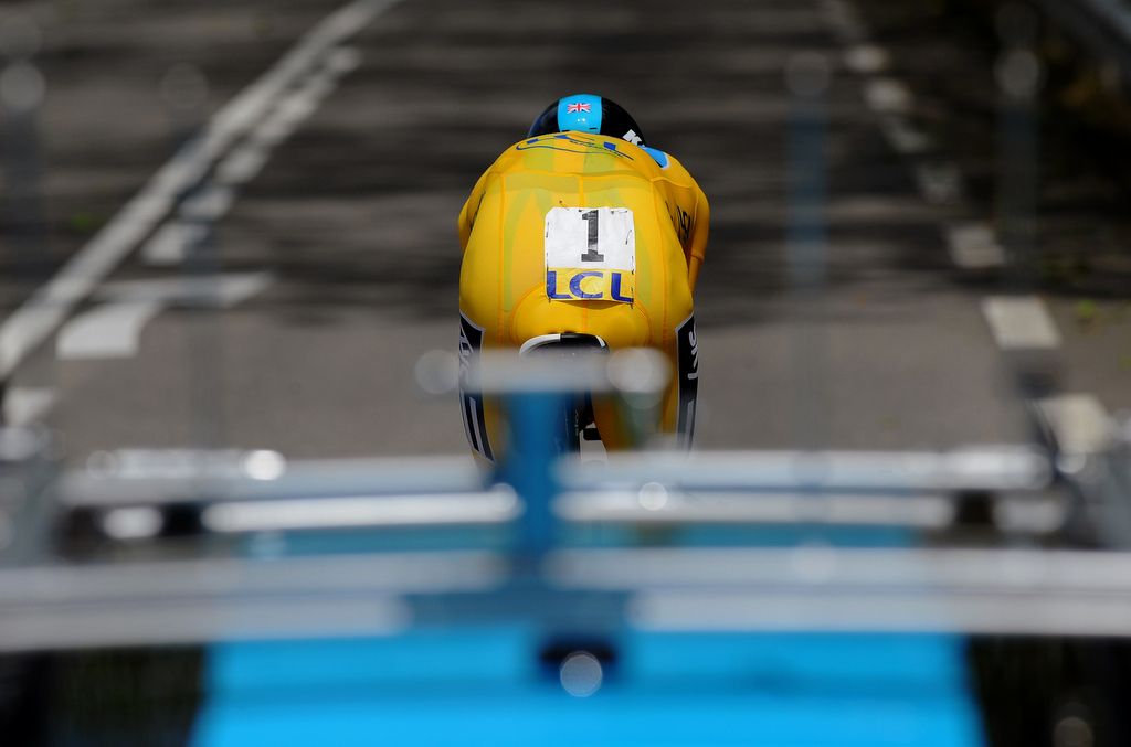 Wearing dossard number, Bradley Wiggins rides to the Bourg-en-Bresse time trial win in 2012