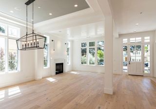 white walls with windows and wooden flooring