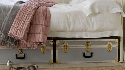 Underbed storage ideas with luggage trunks