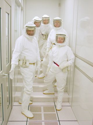 Dressed for the occasion! Today's well-garbed NASA sample return analysis team is much more effective at detecting microbes while avoiding cross-contamination.