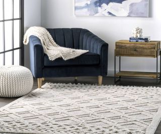 A white textured rug with armchair