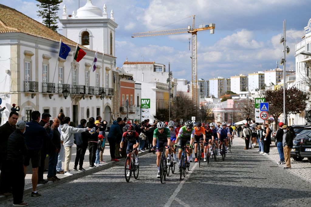 LOULE PORTUGAL FEBRUARY 20 A general view of Nicolas Jonathan Castroviejo of Spain and Team INEOS Grenadiers Fabio Jakobsen of Netherlands and Team QuickStep Alpha Vinyl green points jersey and the peloton passing through a landscape during the 48th Volta Ao Algarve 2022 Stage 5 a 173km stage from Lagoa to MalhoLoul 514m VAlgarve2022 on February 20 2022 in Loule Portugal Photo by Luc ClaessenGetty Images