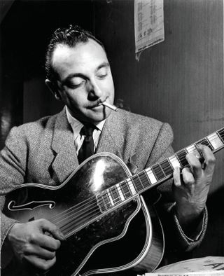 Django Reinhardt shown playing his Selmer-Maccaferri backstage in New York City in 1946. He appreciated the instrument’s tremendous volume, which allowed it to be heard in his ensembles.