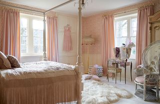 bed room with cream wall and looks attracted in pale pink curtain and blinds