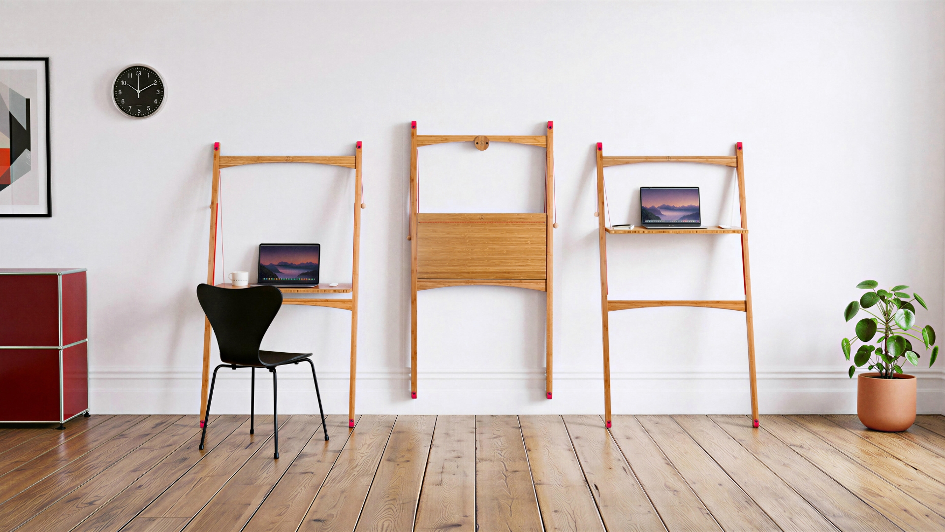 A white room with three sit-stand bamboo folding desks from Leandesk, a red storage cabinet, a potted plant, and a black chair
