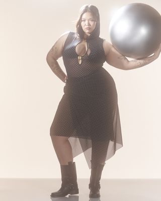 Ganni x Paloma Elsesser Campagin Photography - model holding silver ball