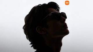 The Xiaomi AI glasses being worn by a model