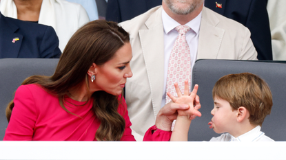Prince Louis of Cambridge 'thumb's his nose' and sticks his tongue out at his mother Catherine, Duchess of Cambridge