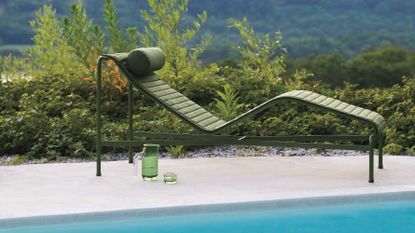an outdoor chaise lounge in green