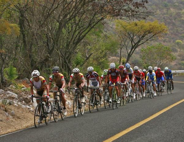 The peloton lines out behind the tempo being set at the front