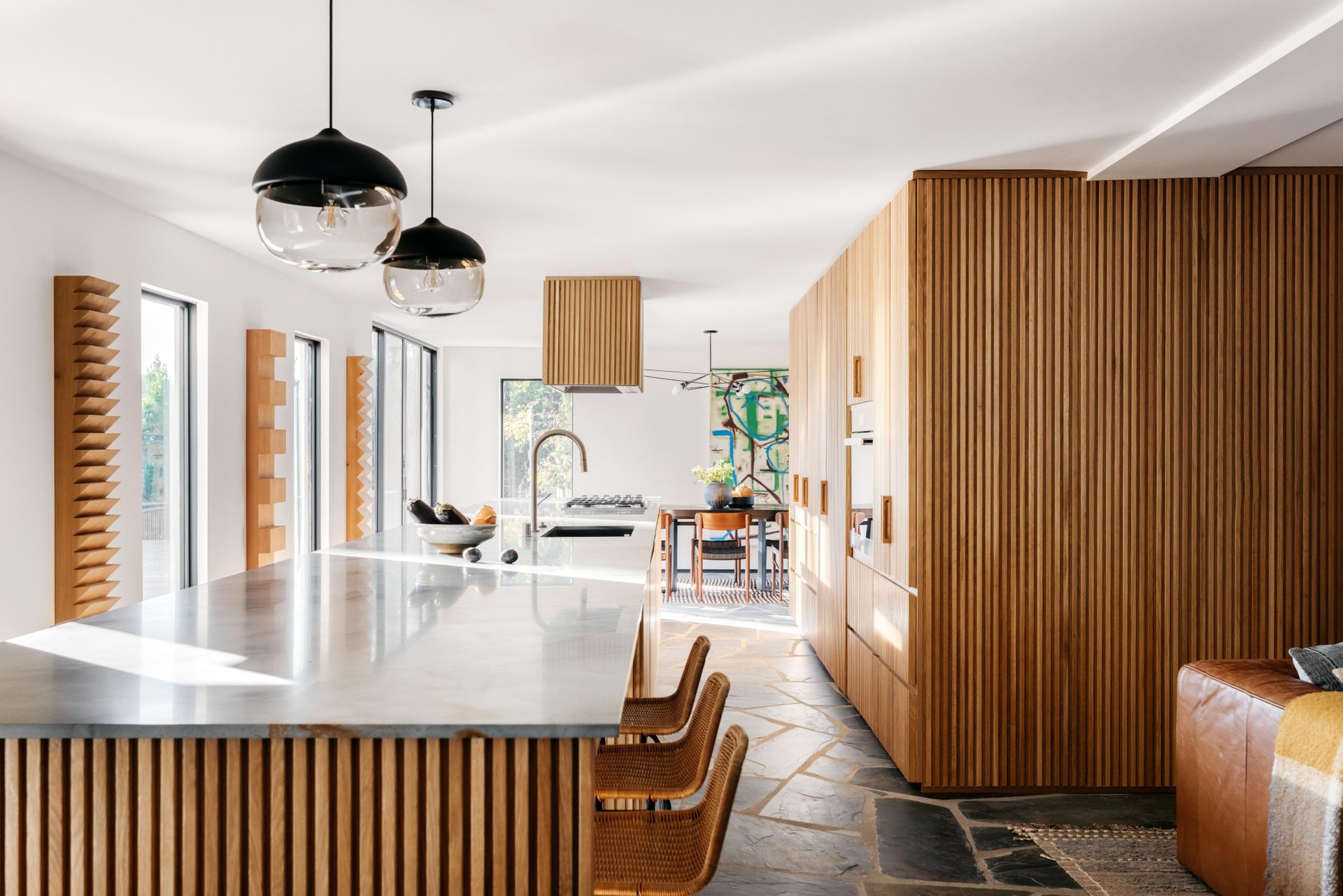 kitchen with fluted wood island and cabinets
