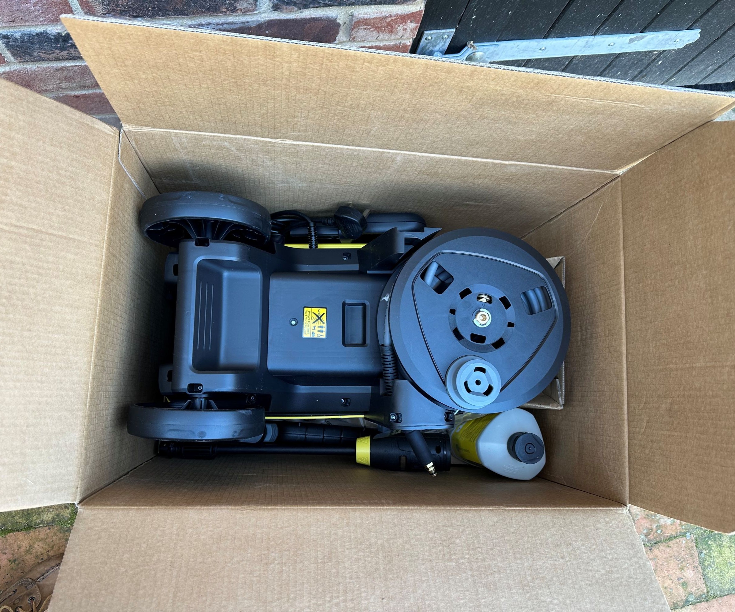 A yellow K&auml;rcher K5 comfort premium pressure washer after unboxing and assembling