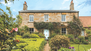 Victorian sandstone house set in mature gardens