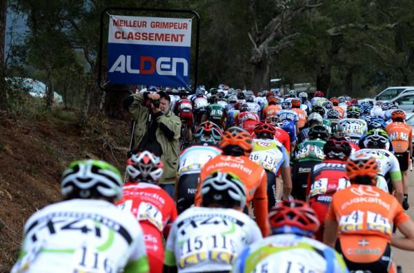 The peloton heads up the climb