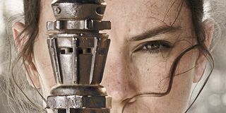 Rey wielding her staff in a poster for Star Wars: The Force Awakens