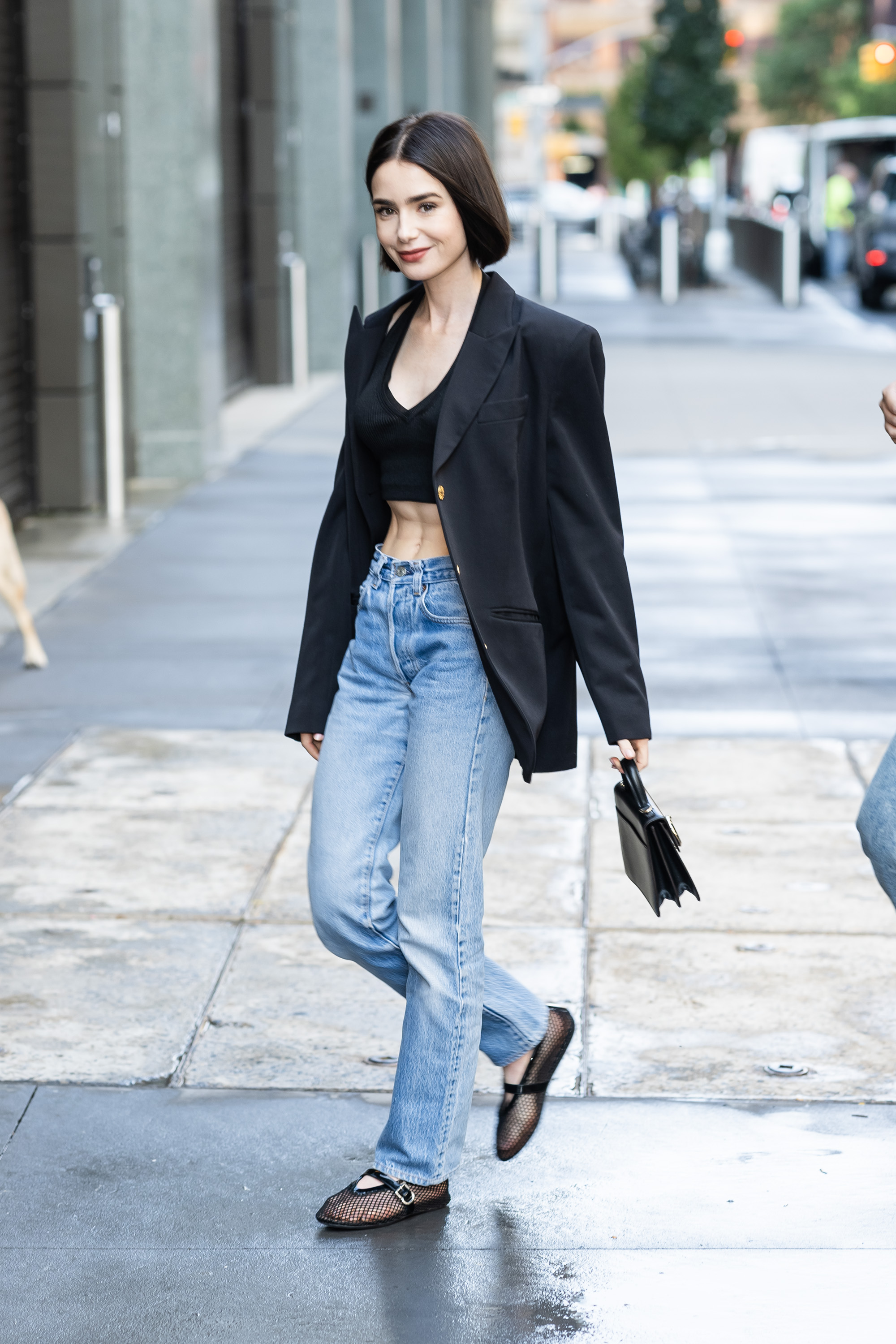 Lily Collins wore the mesh ballet flats from Ala&amp;iuml;a in 2024