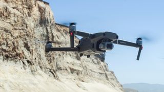 DJI Mavic 2 Pro flying against a coastline landscape