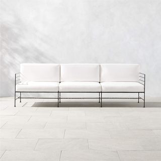 White outdoor sofa with black iron legs