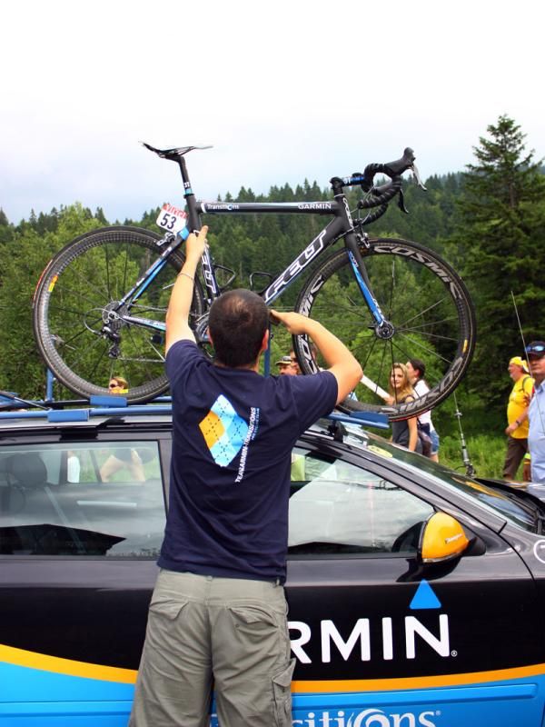 Team mechanic Inaki Goiburu wastes no time in getting Tyler Farrar's bike loaded on top of the team car for the journey to that night's hotel.