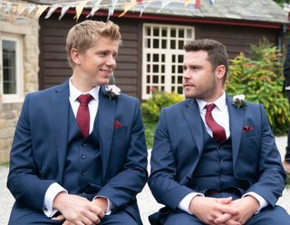 Robert (Ryan Hawley) and Aaron (Danny Miller) on their wedding day in Emmerdale 