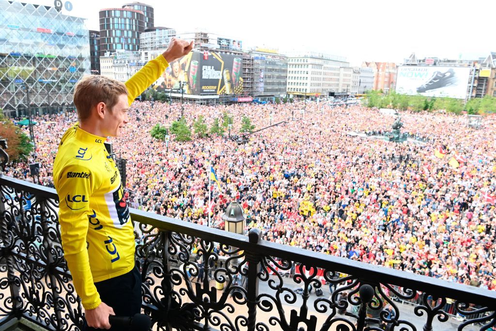 Jonas Vingegaard waves to the huge crowds in Copenhagen