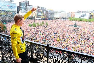 Jonas Vingegaard waves to the huge crowds in Copenhagen