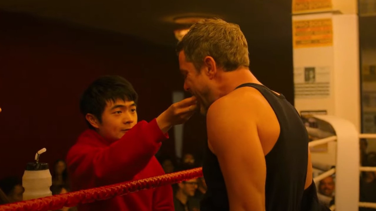 Ben Wang putting a mouth piece into Joshua Jackson&#039;s mouth in Karate Kid: Legends