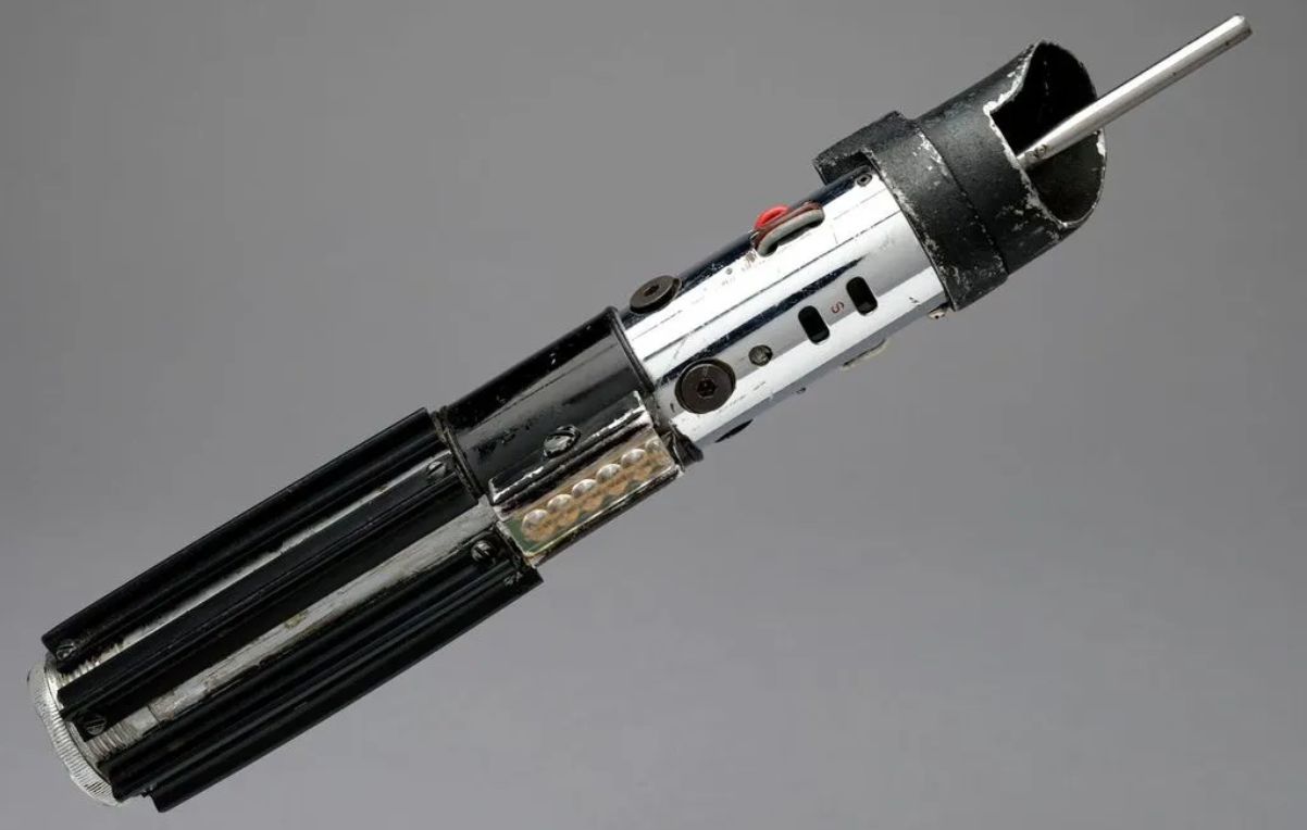 the hilt of a sci-fi lightsaber prop