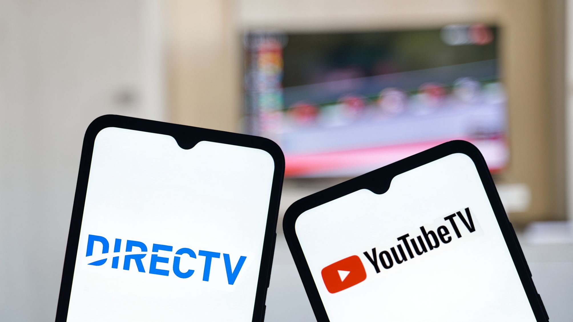 2 phones with the logo for DirectTV and YoutubeTV on them.