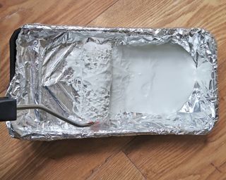 Lining a paint tray with foil