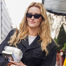 Sarah Pidgeon in Paris during Paris Fashion Week wearing a black Celine jacket, dark-wash cropped jeans, and black loafers. 