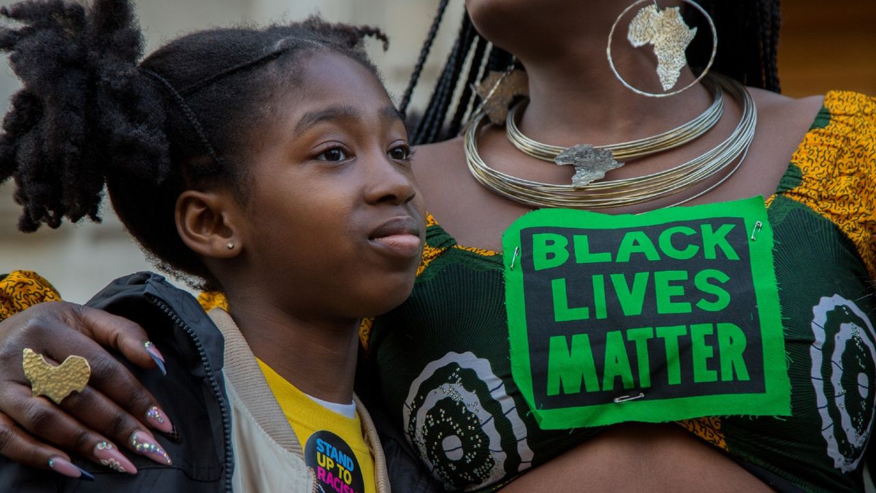 Protesters with Black Lives Matter sign