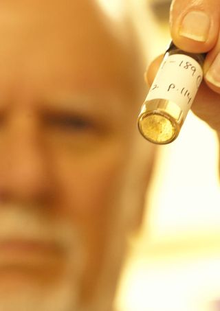 Jeffrey Bada holds Miller&#039;s old sample vial